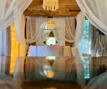 Harmony cabin bedroom with queen four-poster bed