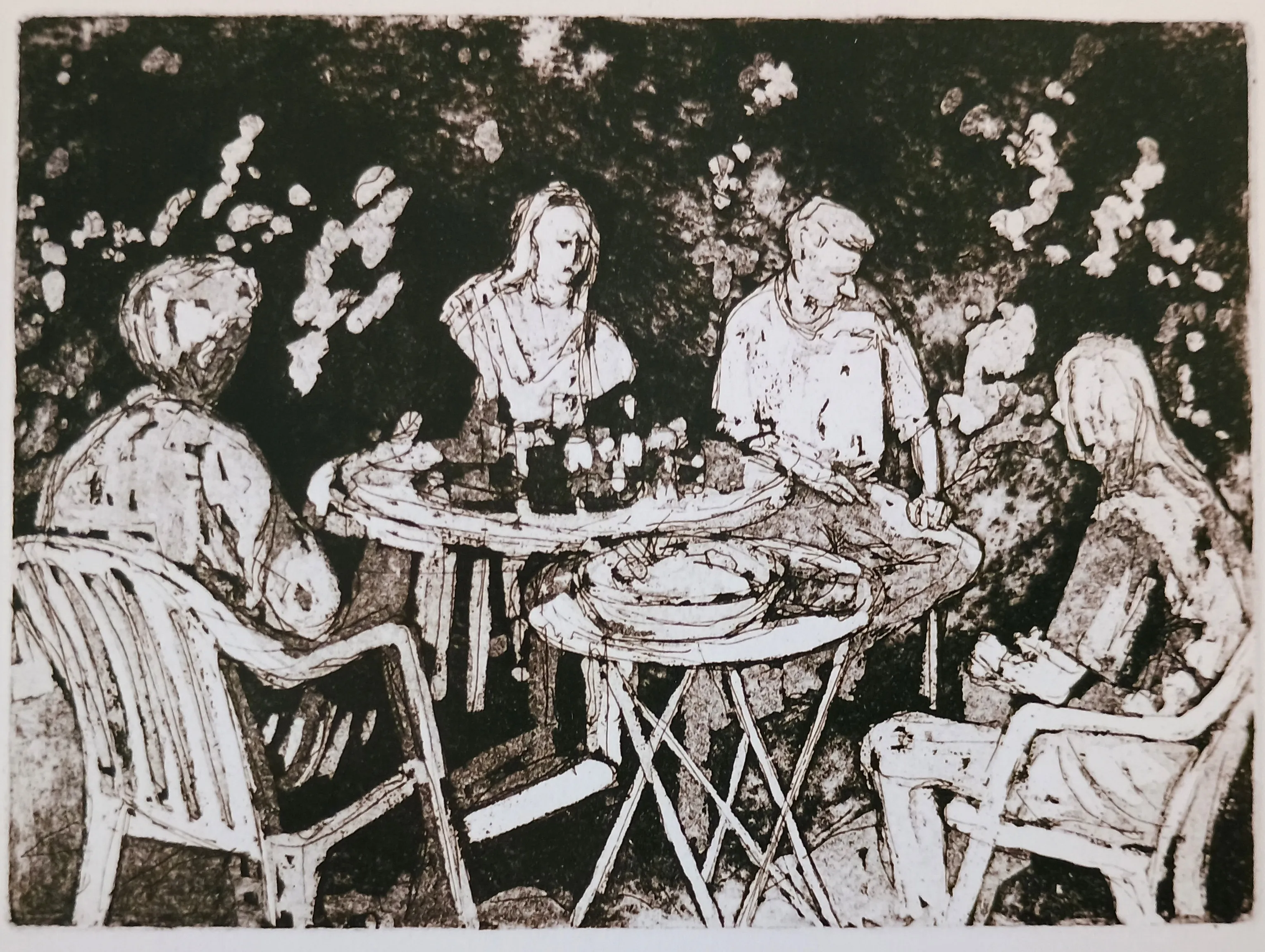 Black and white sketch of four people seated around two tables with food and drinks, in plastic chairs.