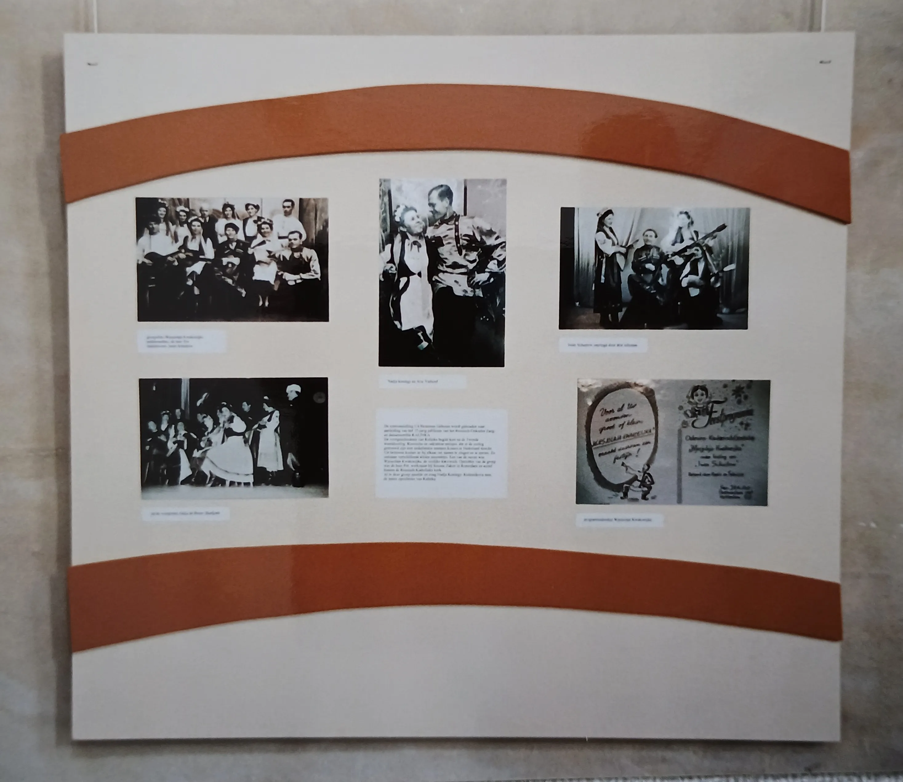 Exhibition board with five black-and-white photographs and a card, arranged in two rows, featuring people in traditional or vintage clothing.