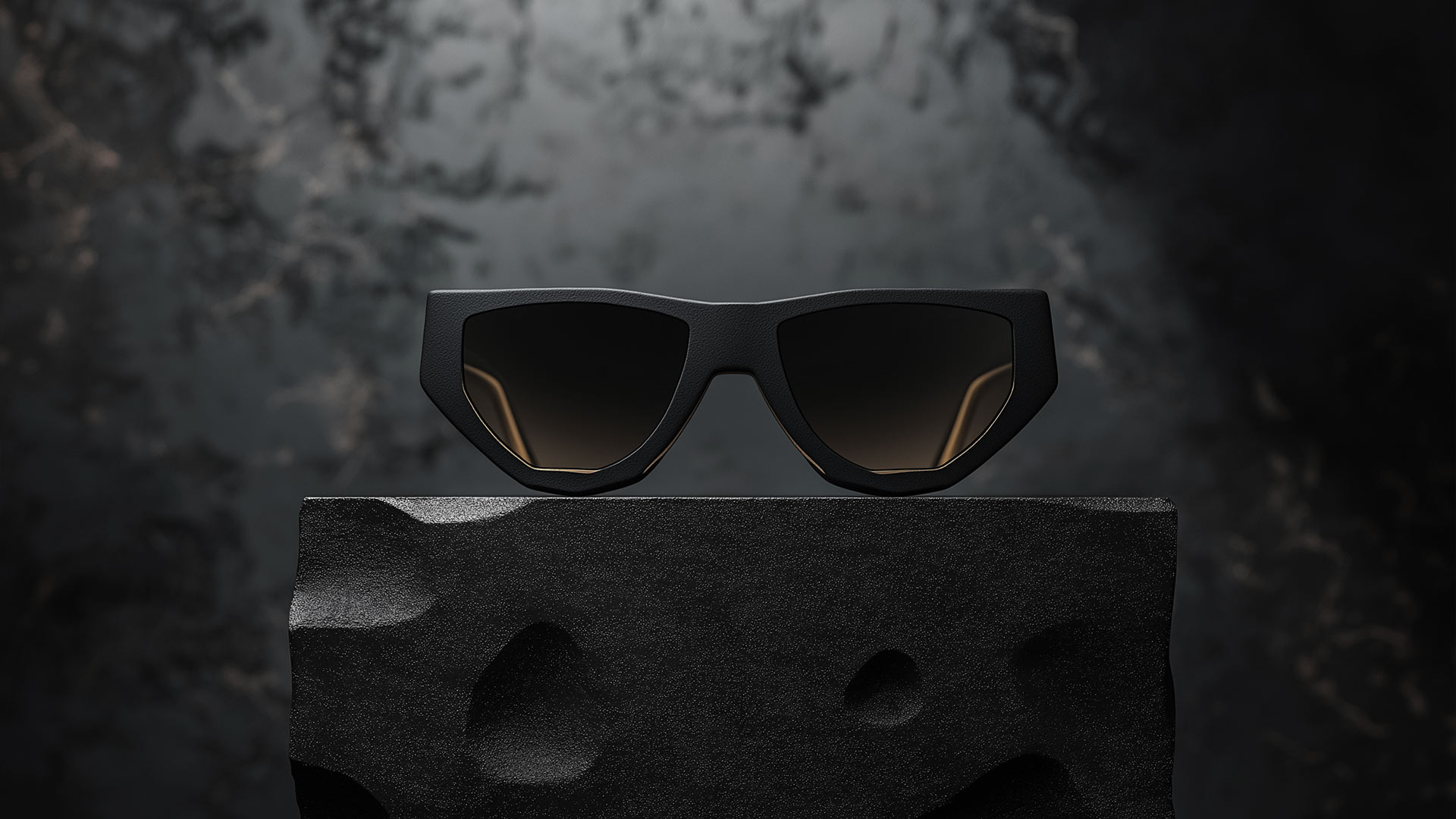 Black futuristic glasses on the dark stone.