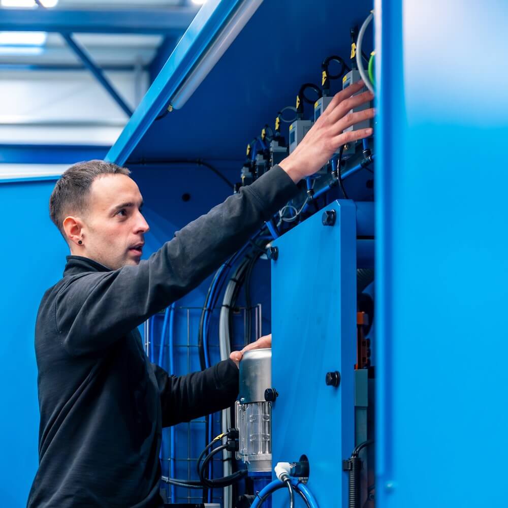 ROLV service technician maintaining a reverse vending machine
