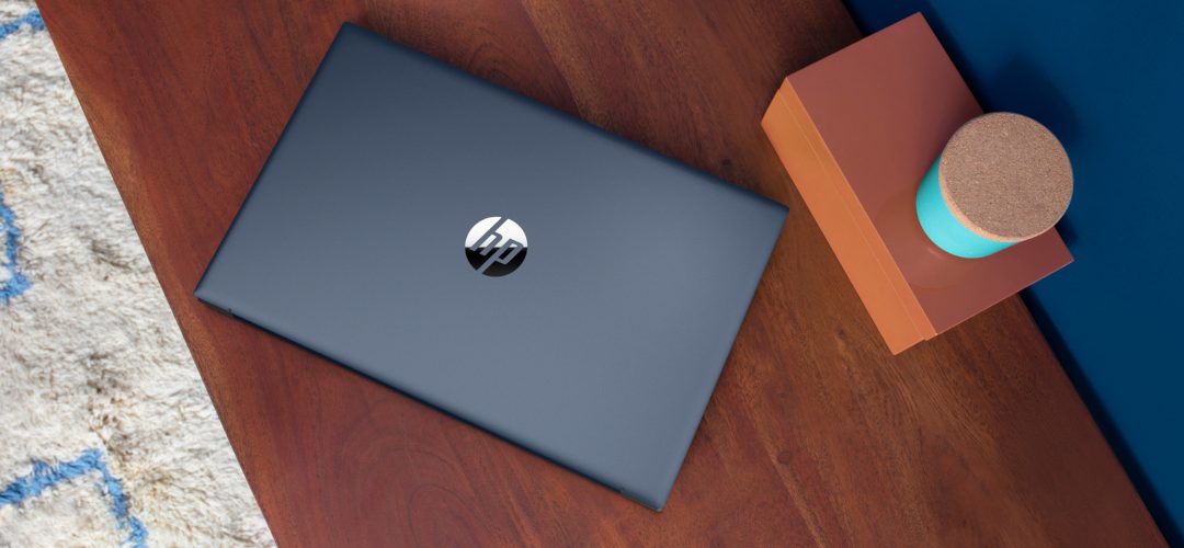 HP laptop on a wooden desk