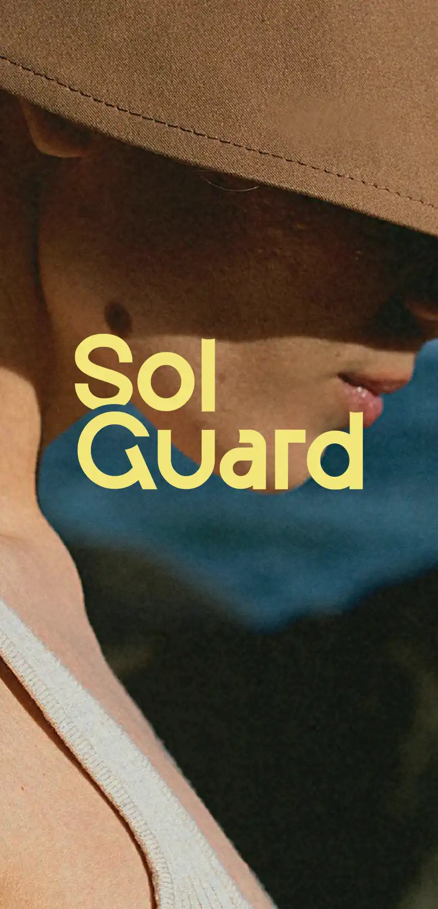 Close-up side view of a person wearing a wide-brimmed hat and light tank top, with the word 'SolGuard' overlaid.