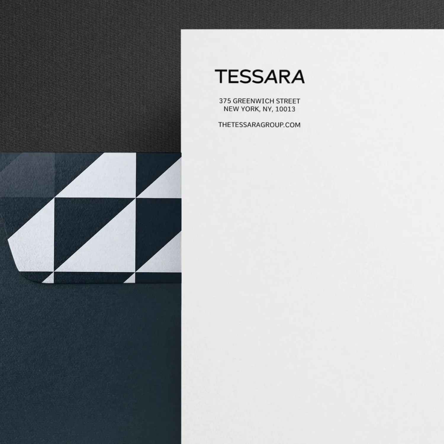 Letterhead with the company name TESSARA, address and website thetessaragroup.com, alongside a geometric dark blue and white patterned envelope.