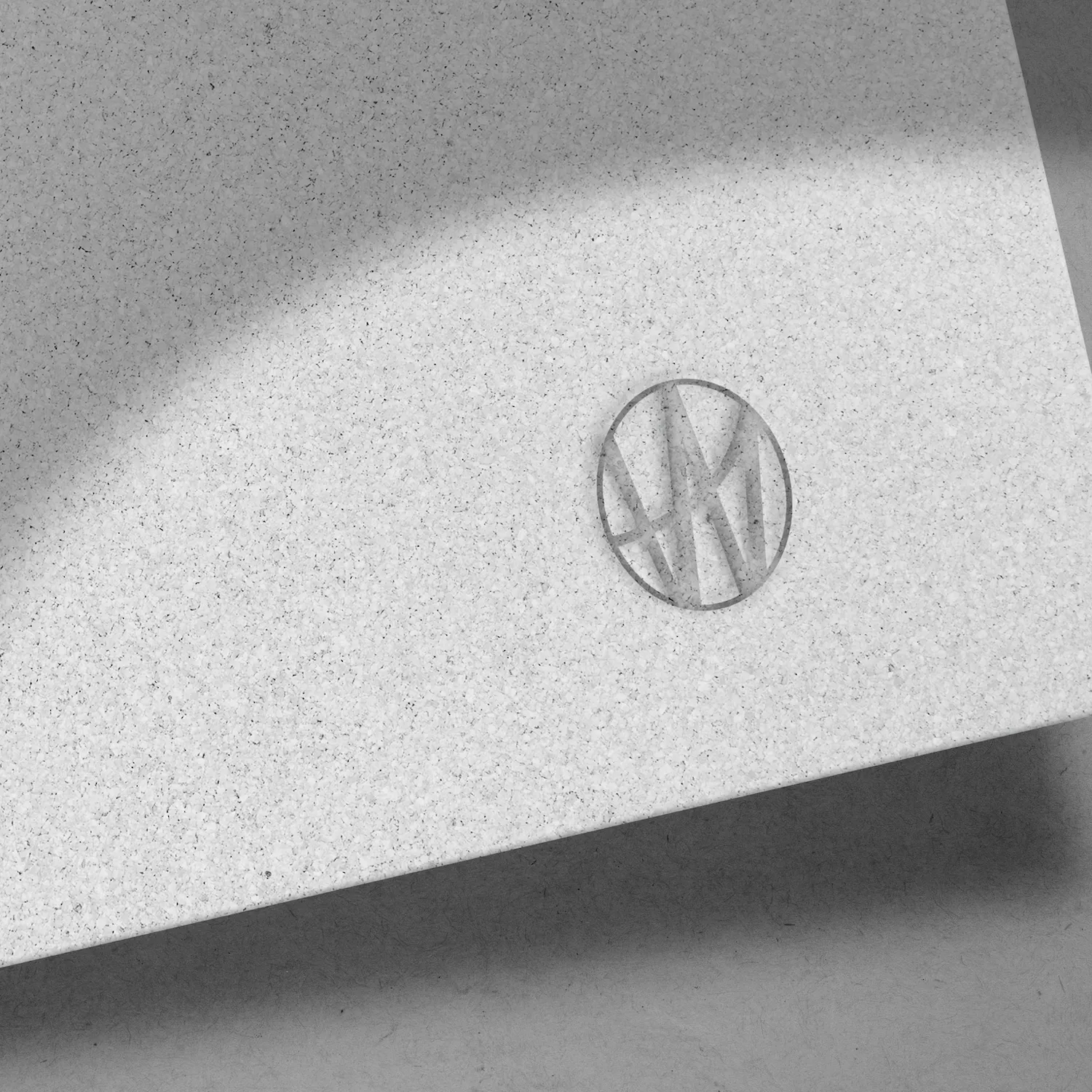 Textured white surface with a circular embossed logo for Watkins Range.