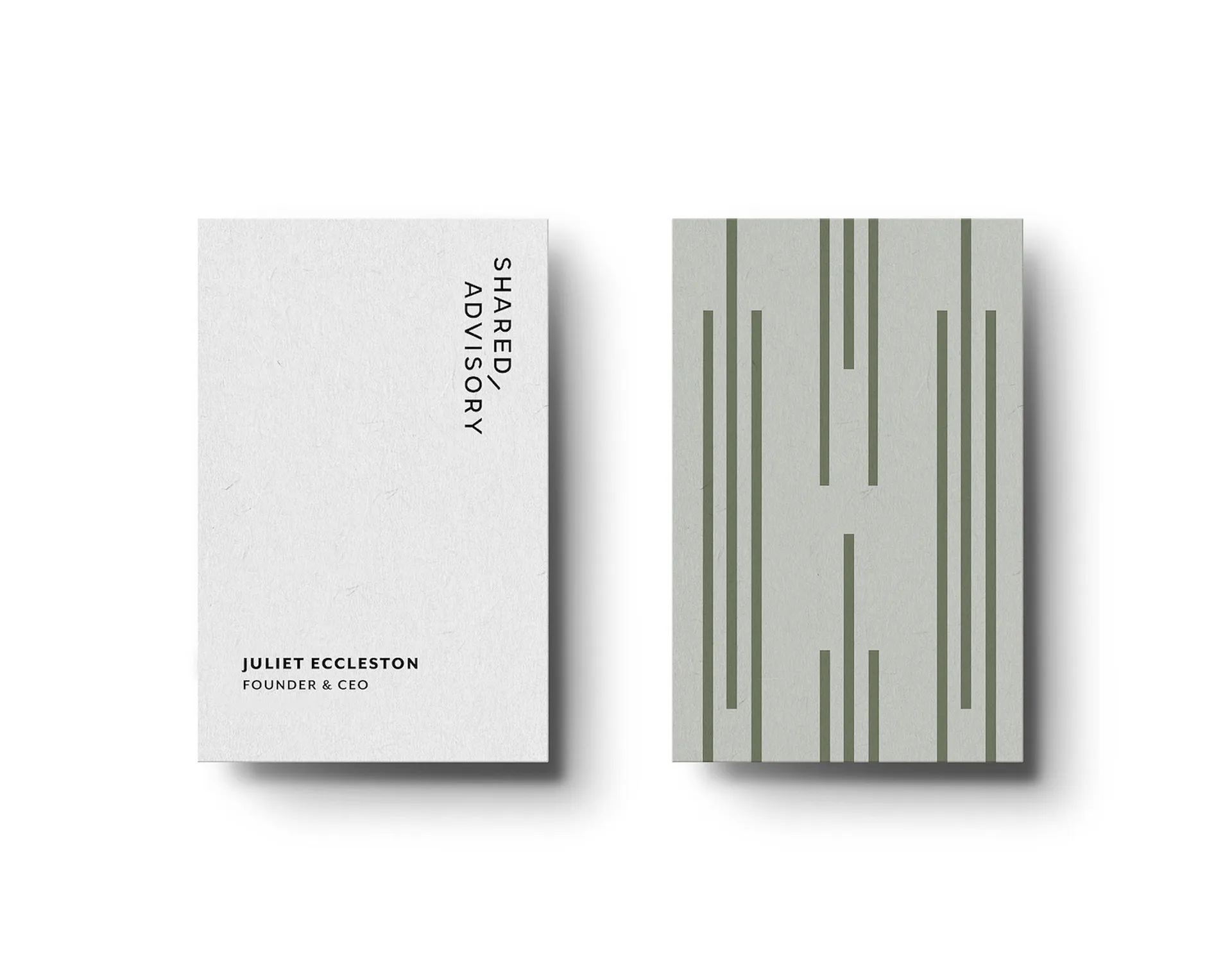 Minimalist double-sided business card with 'SHARED ADVISORY' vertically and 'JULIET ECCLESTON FOUNDER & CEO' on white side, and vertical green lines on light grey back side.