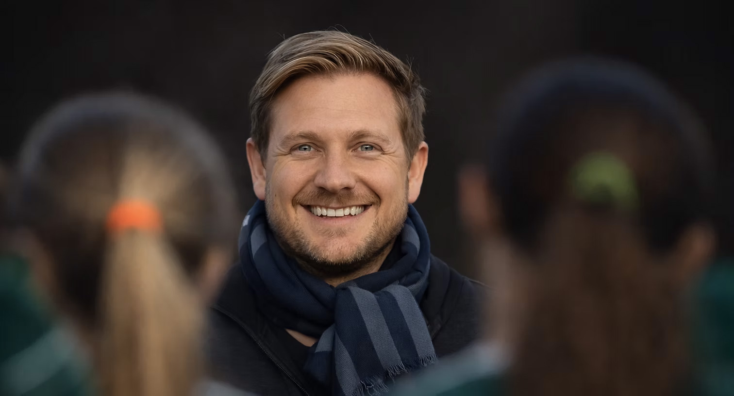 Dr. Ched Garten with Falcons medical staff helping an injured NFL player on the field during a game