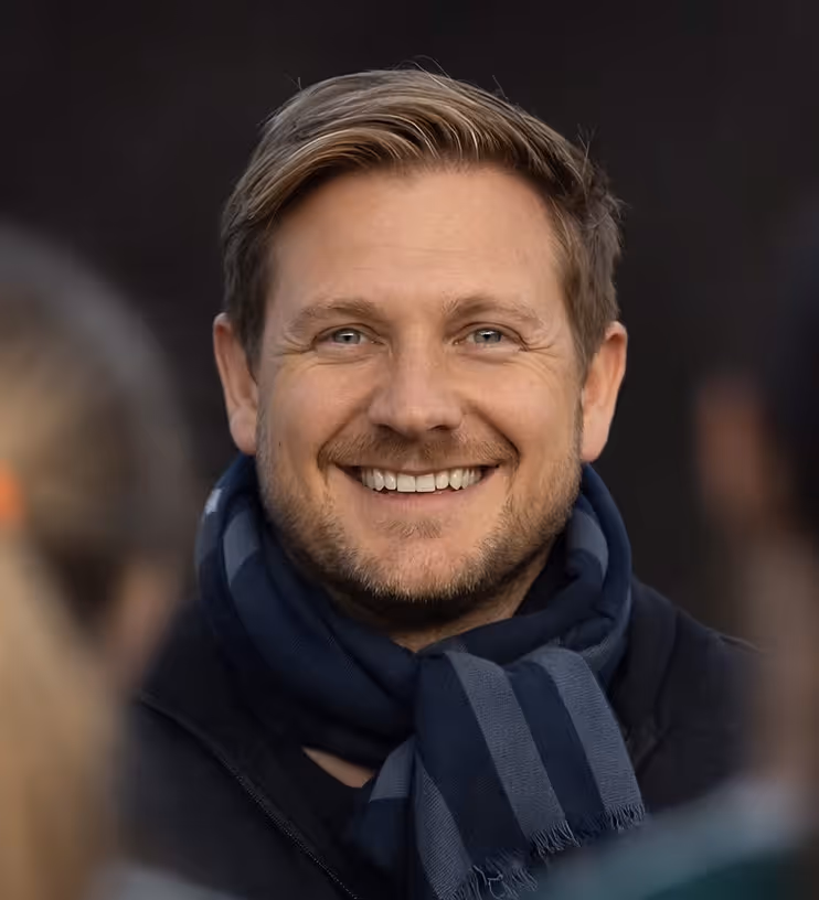 Dr. Ched Garten with Falcons medical staff helping an injured NFL player on the field during a game