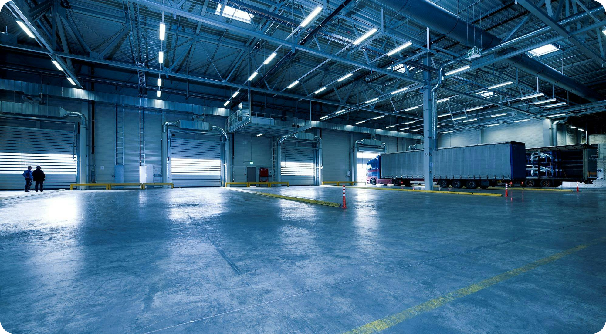 Large warehouse with trucks and loading docks for storage and distribution
