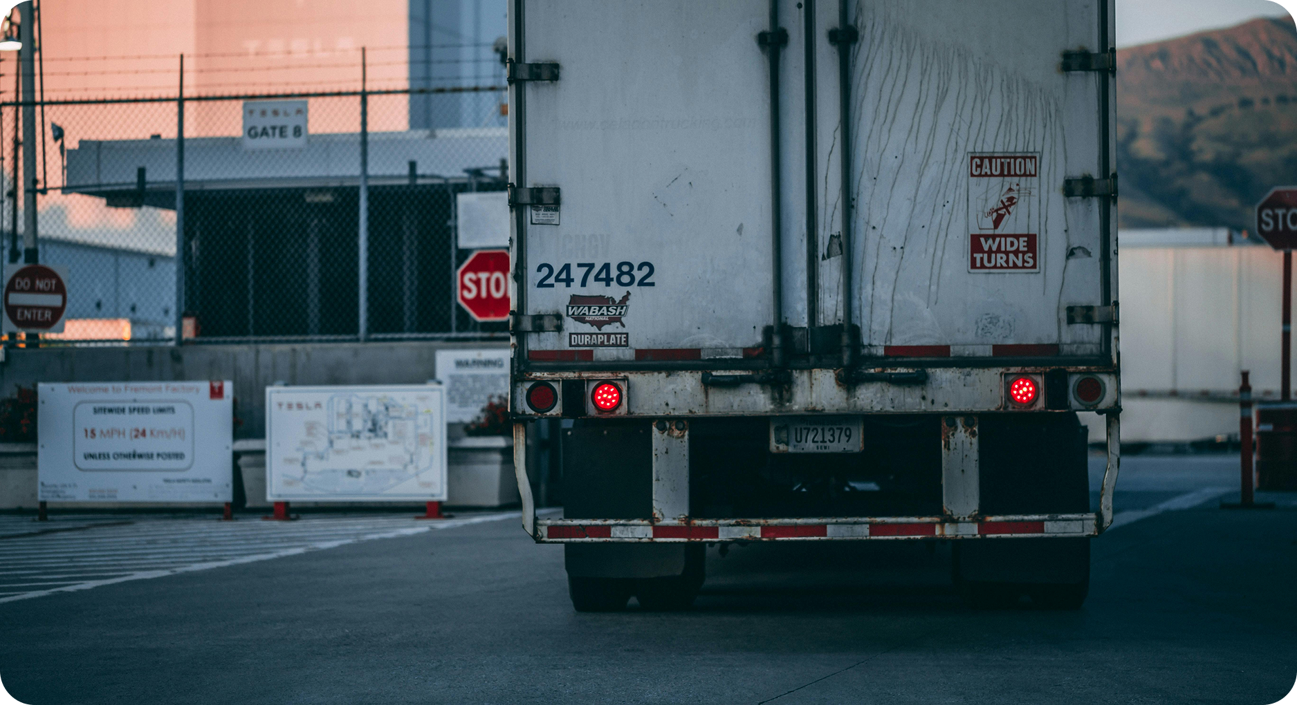 Back view of a container truck for drayage services at port