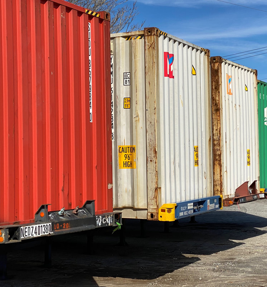 Shipping containers in storage yard representing intermodal freight logistics