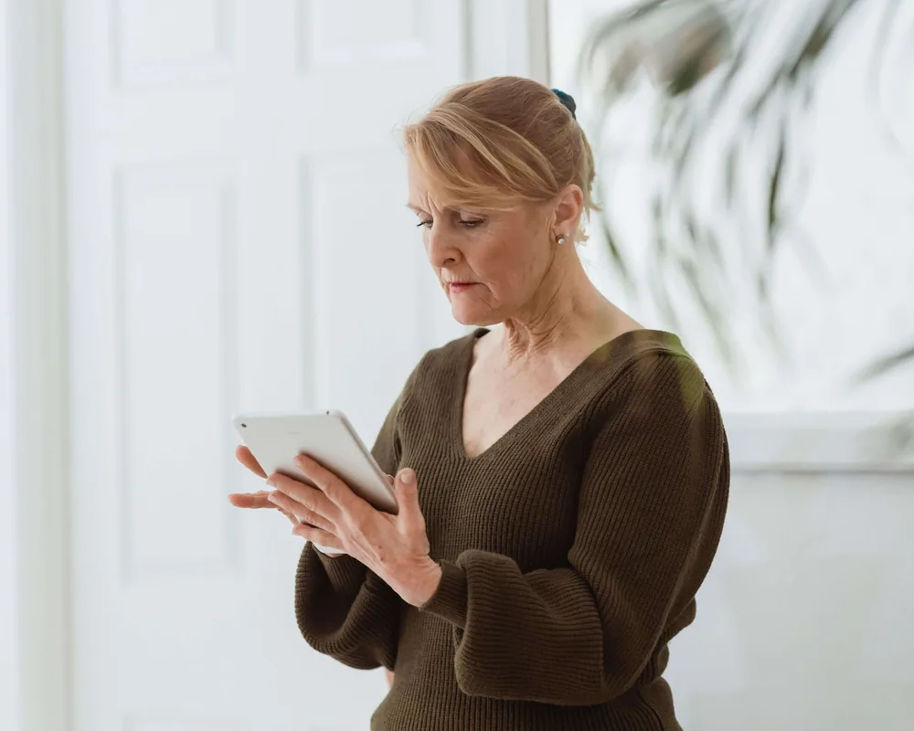 Woman using a tablet at home