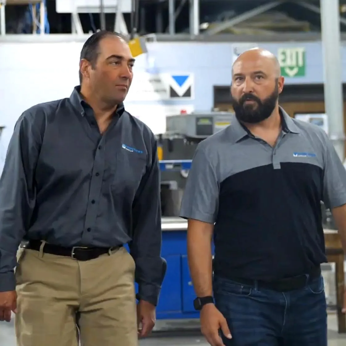 matt and justing walking through print plant