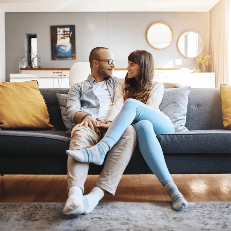 Happy couple sitting on couch