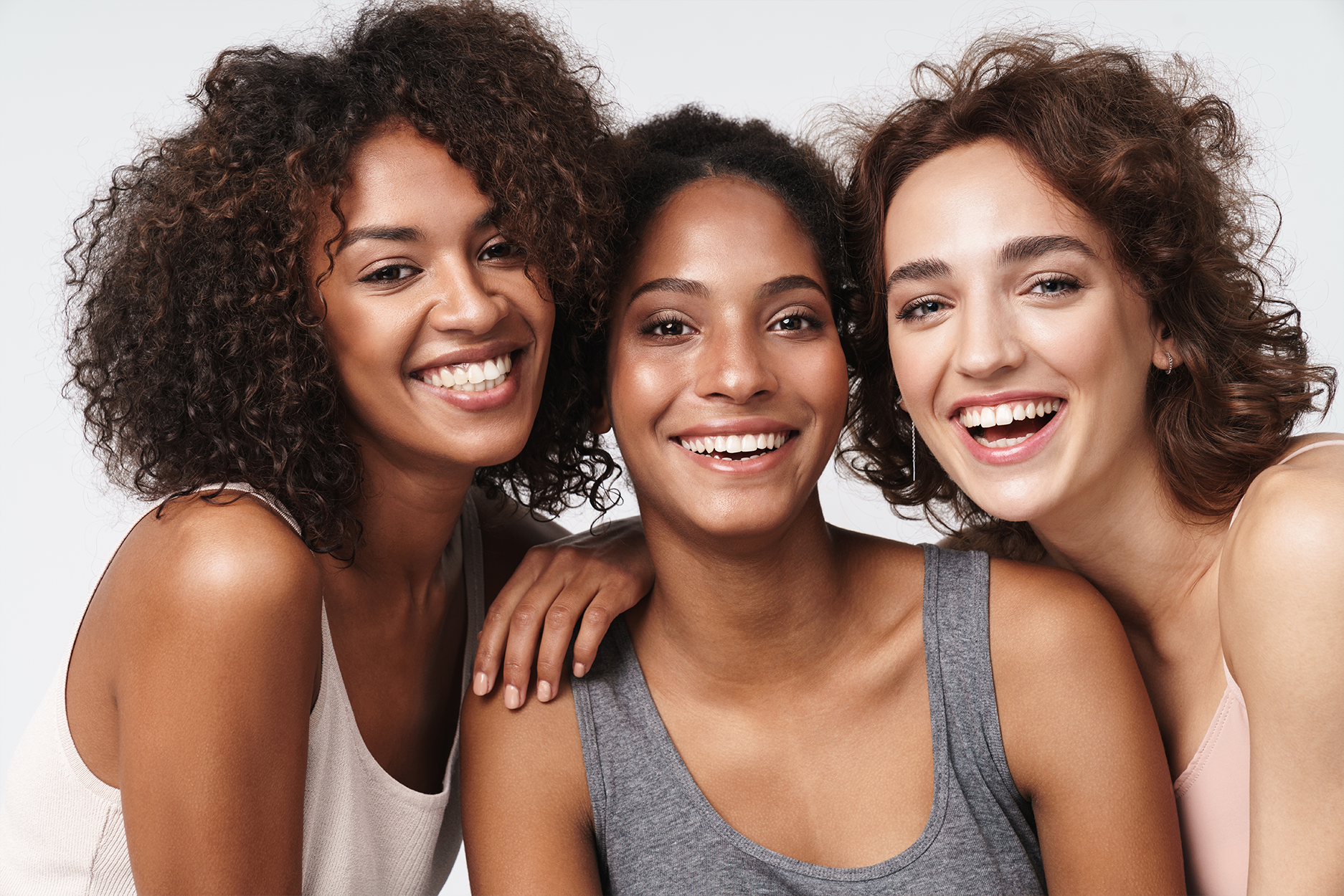 3 girls with brown hair smiling