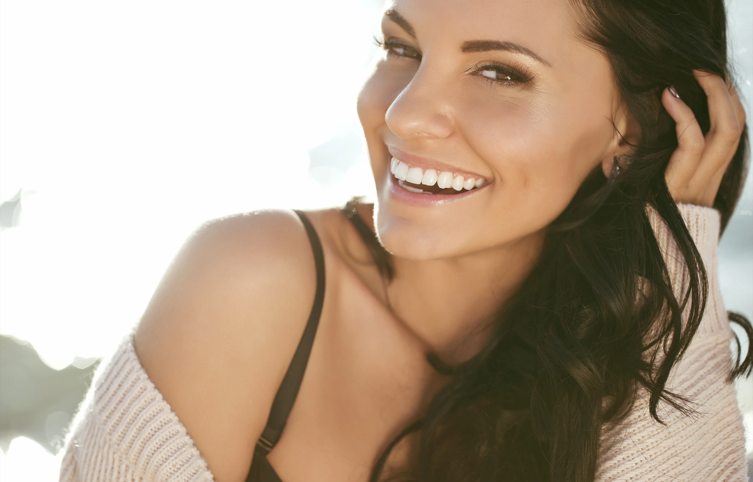 woman with dark brown hair smiling