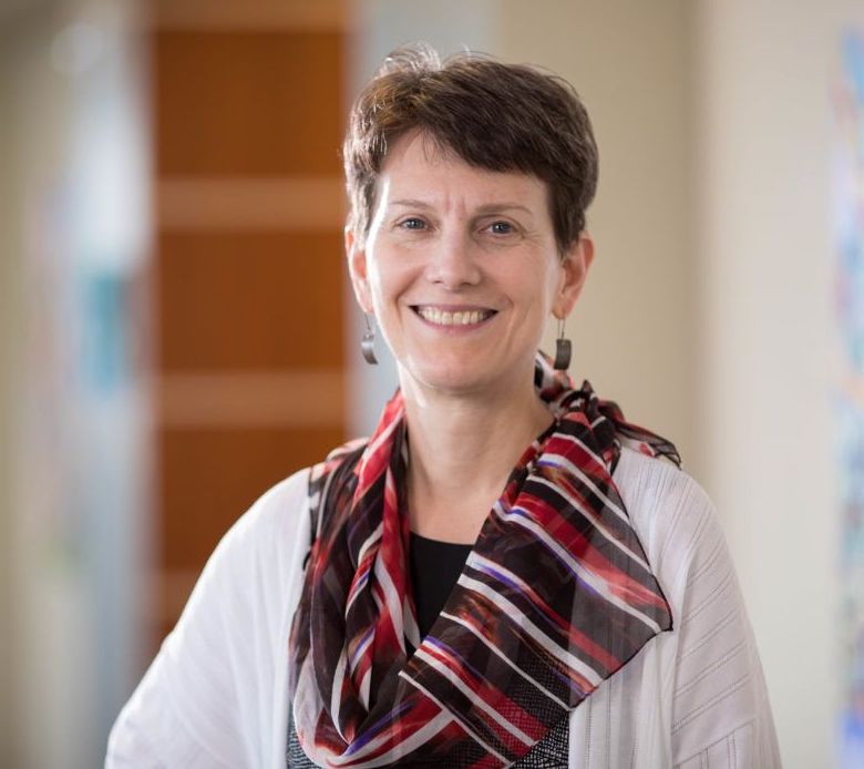 Headshot of a professional advisor, smiling.