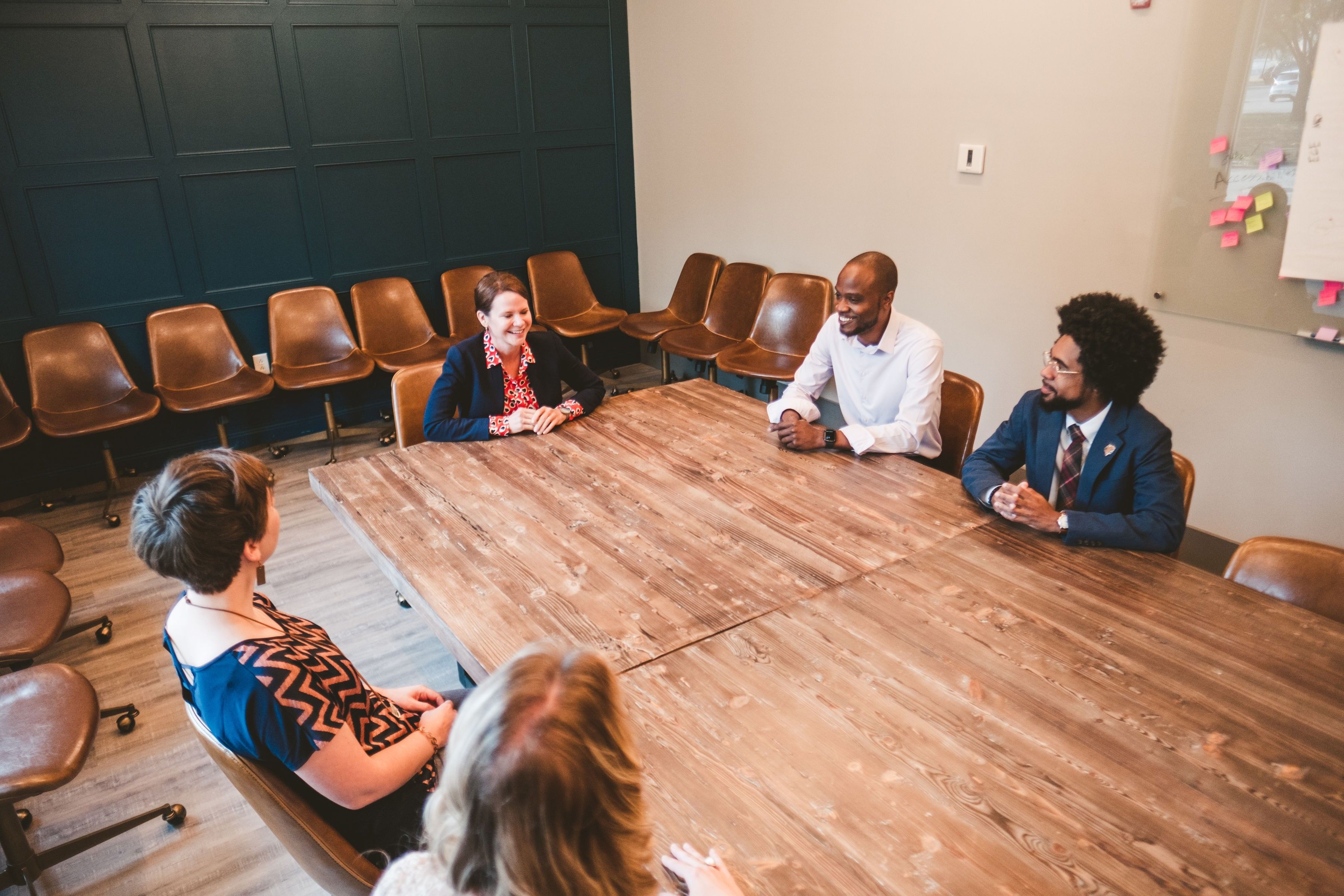 Group image of several CFGC staff in the boardroom.