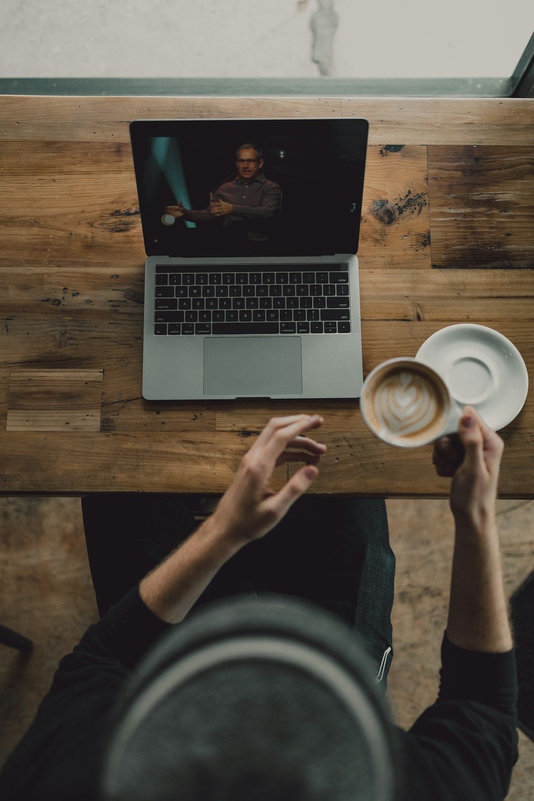 Person joining a video coaching session on a laptop