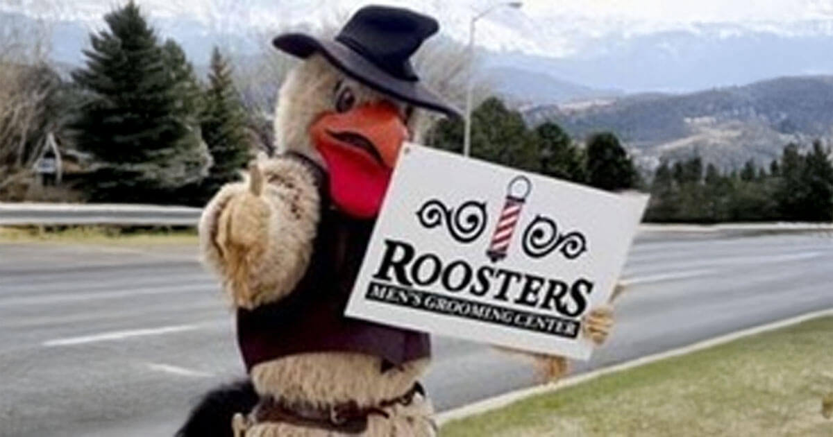 Rooster mascot holding a Rooster