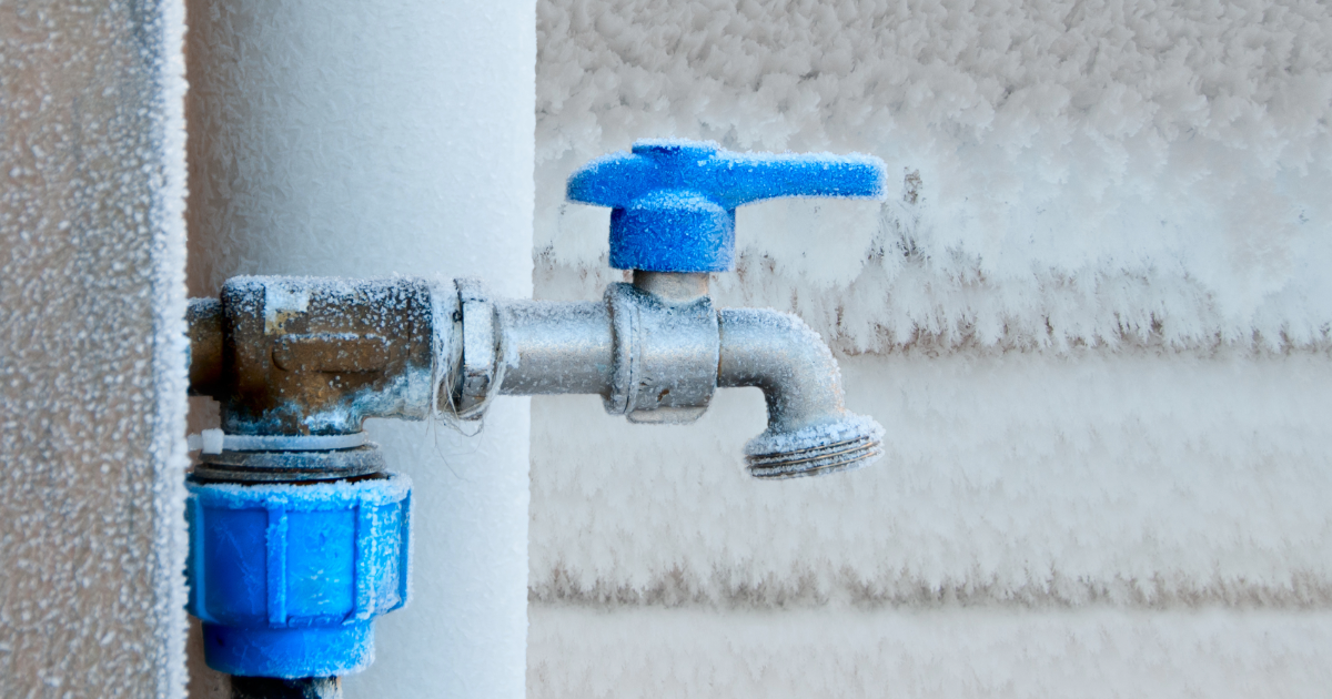 Frozen outdoor faucet in winter.