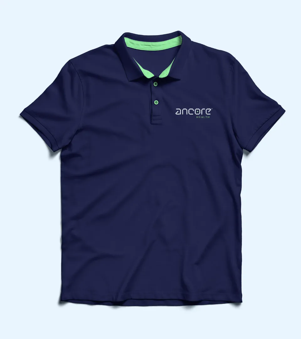 Navy blue polo shirt with light green inner collar and two green buttons, featuring 'ancore HEALTH' logo on the left chest.