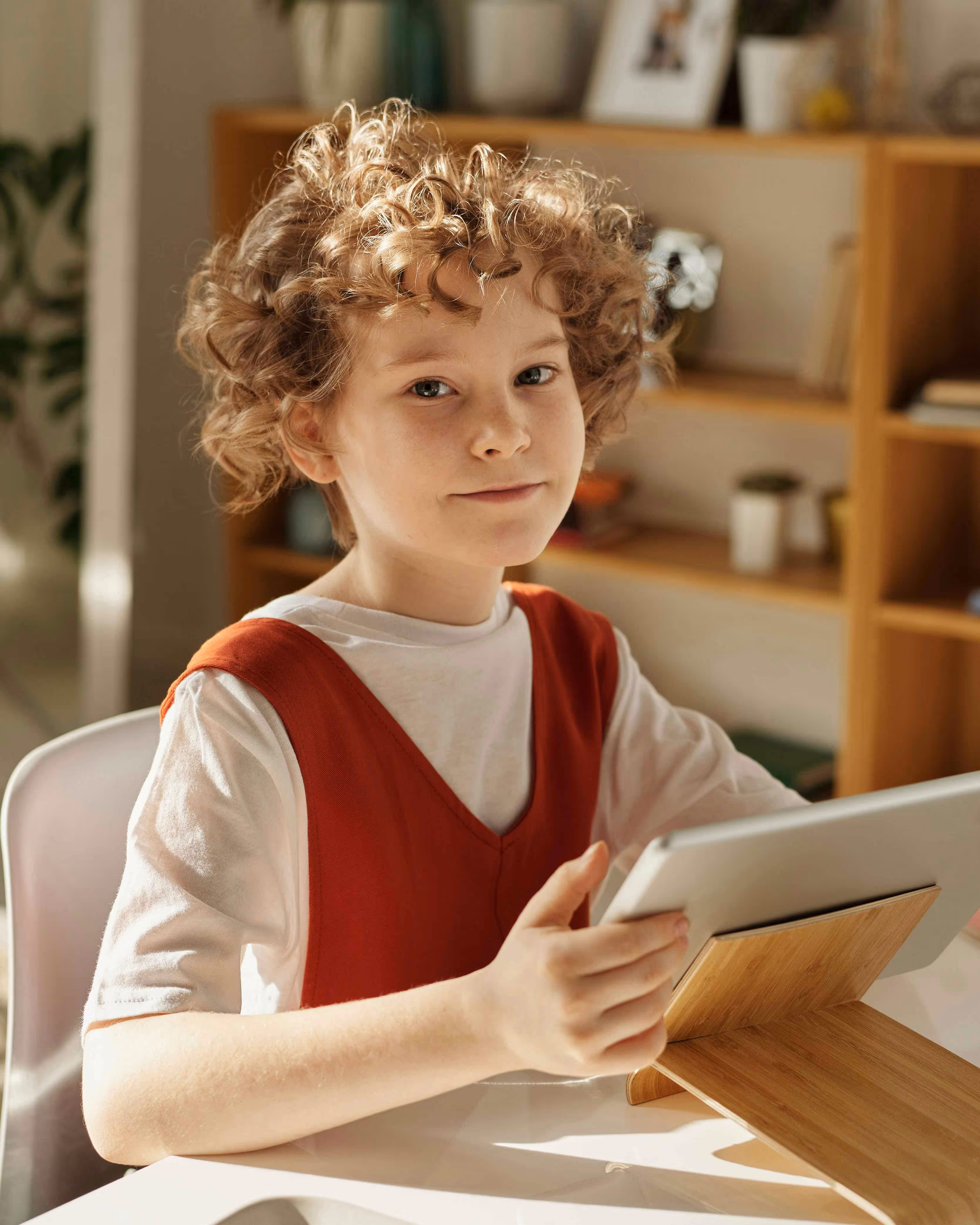 Young person learning about AI literacy through digital education using a tablet device.