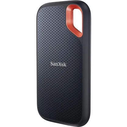 Portable black and orange SanDisk external solid state drive.