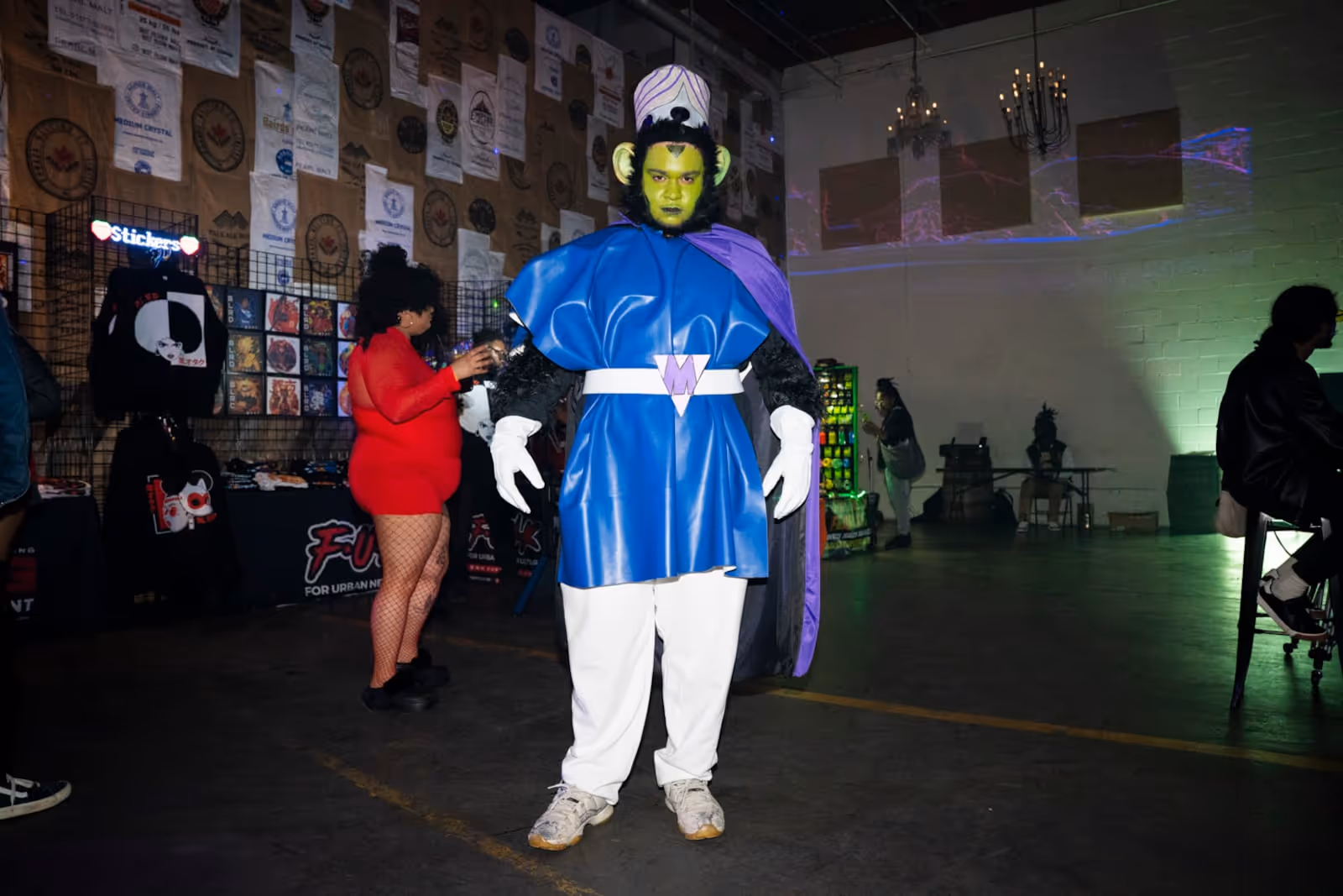 Riley Edwards is dressed in cosplay as 'Mojo Jojo' from the Power Puff Girls at Cxmmunity Media's partnership with local event brand Trap Sushi  at Monday Night Garage in Atlanta Georgia, on Friday, Feb. 23, 2024. (Olivia Bowdoin for the AJC). 