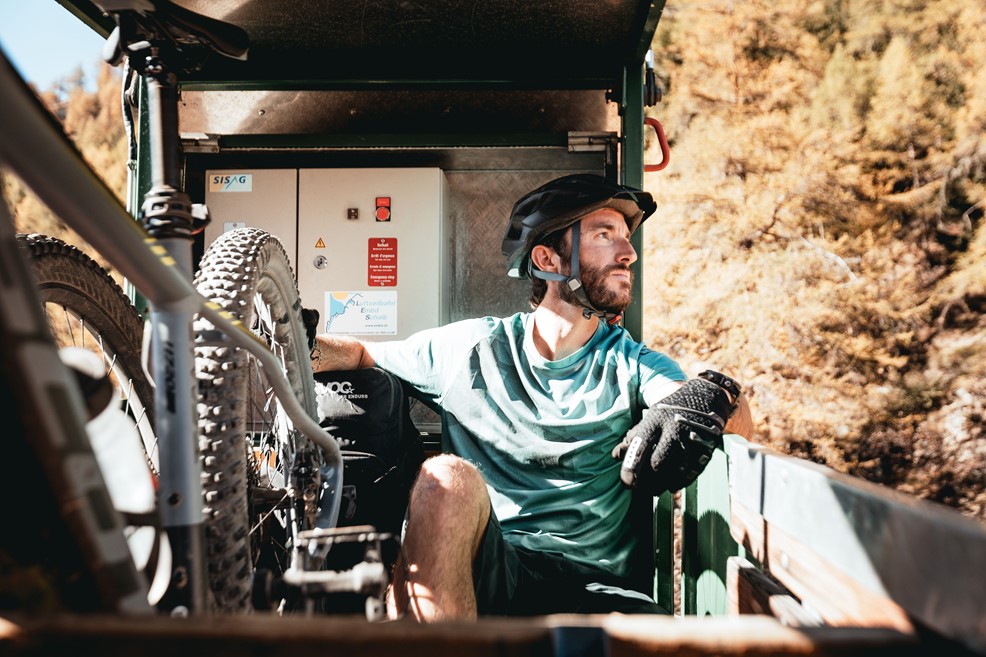 Mountain biker appreciating the landscape from a gondola