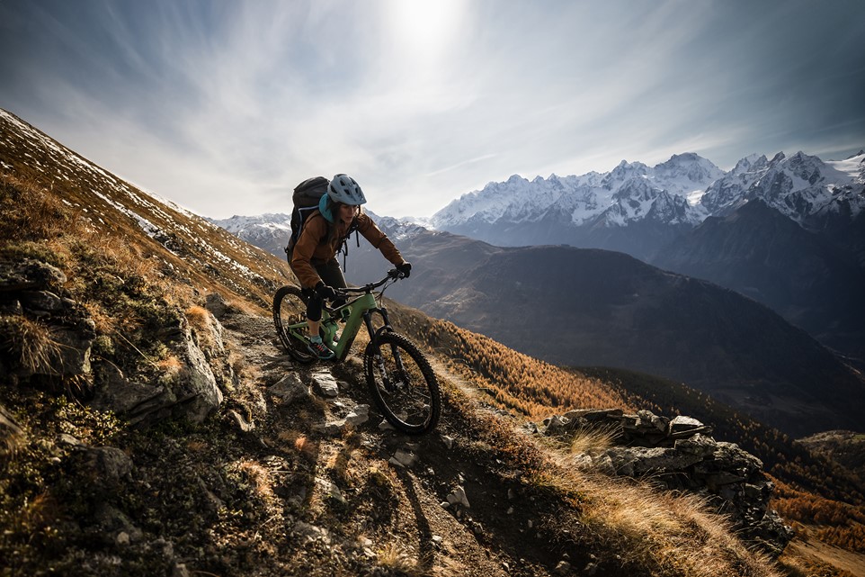 Female mountain biker riding around Verbier