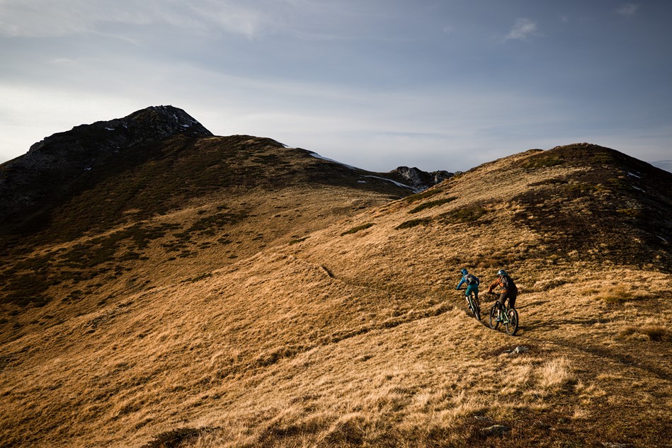 Two riders on a high-altitude single track trail