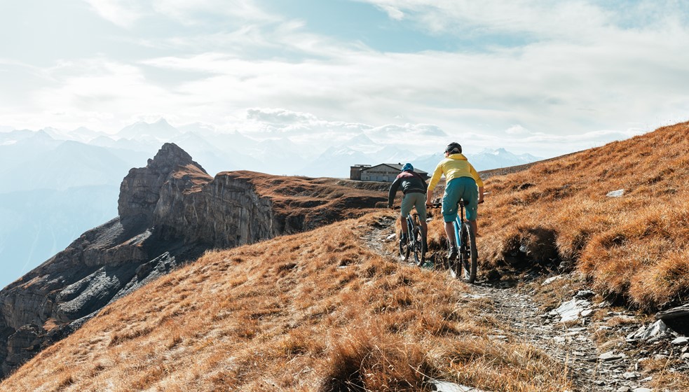 Two riders on a rocky alpine trail