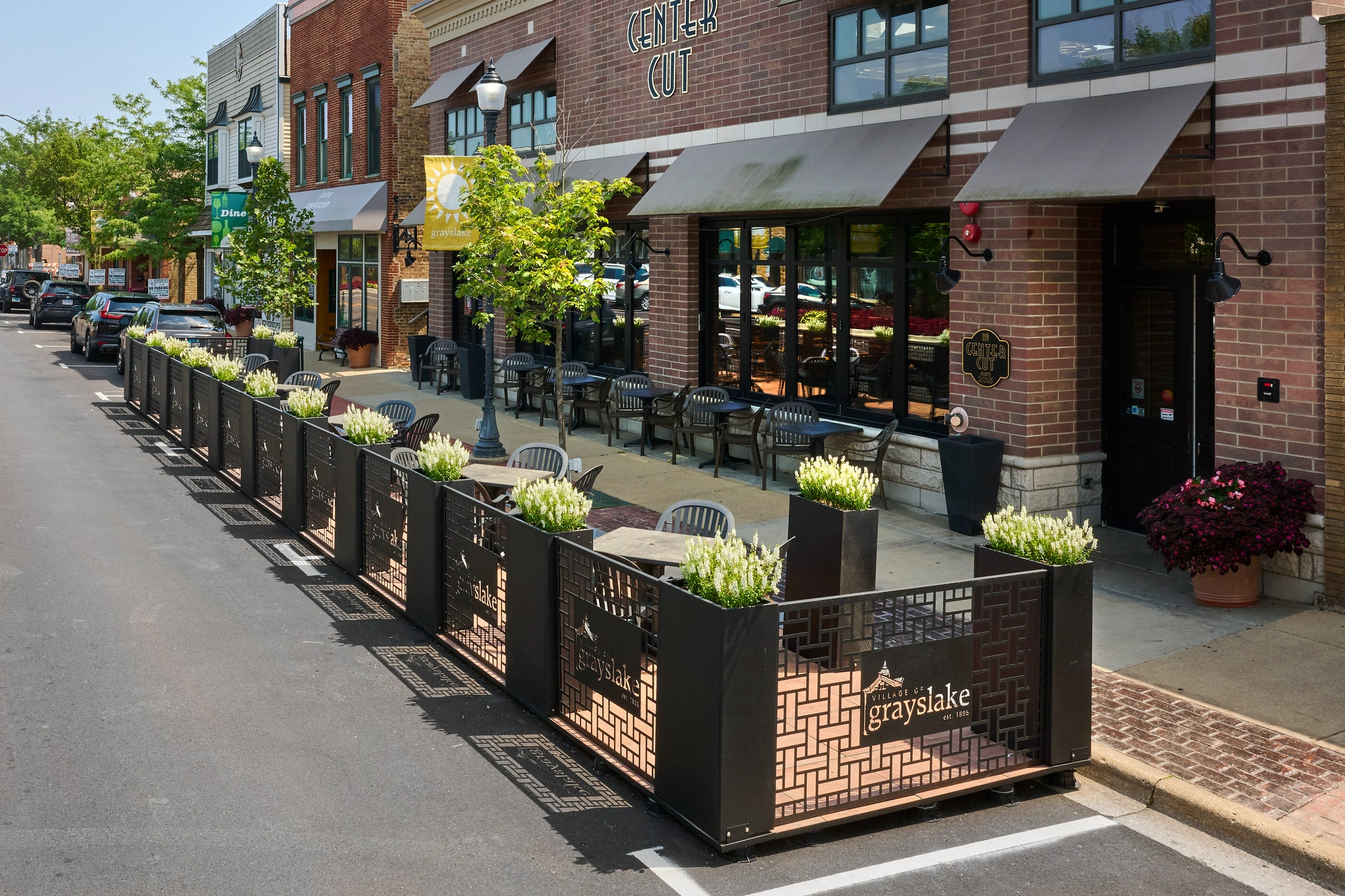 StreetDeck parklet in Grayslake Illinois with custom fence panels.