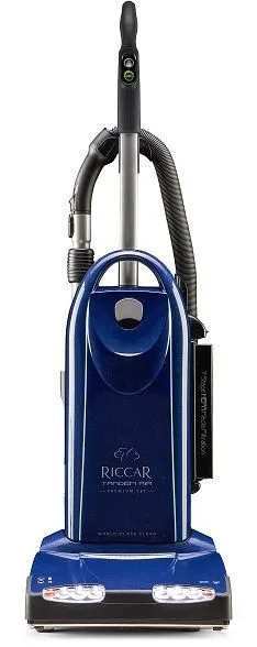 Blue Riccar upright vacuum cleaner with handle and hose against a white background.