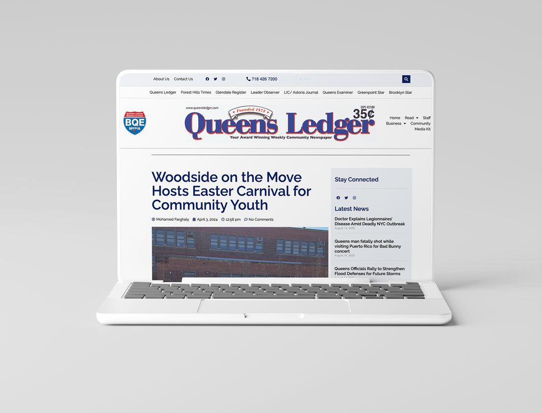 White laptop displaying Queens Ledger website with headline 'Woodside on the Move Hosts Easter Carnival for Community Youth'.