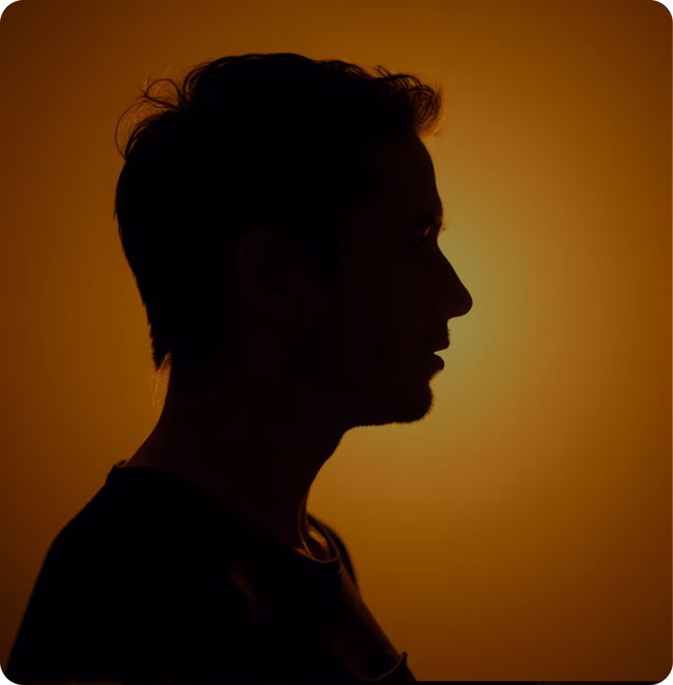 A silhouette of a man's head against a yellow background.