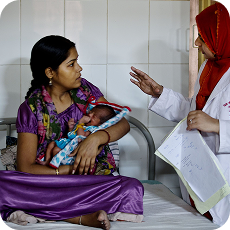 Mother with child receiving health guidance