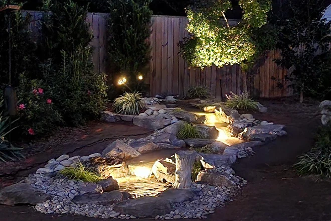 Underwater pond lights in a pondless waterfall