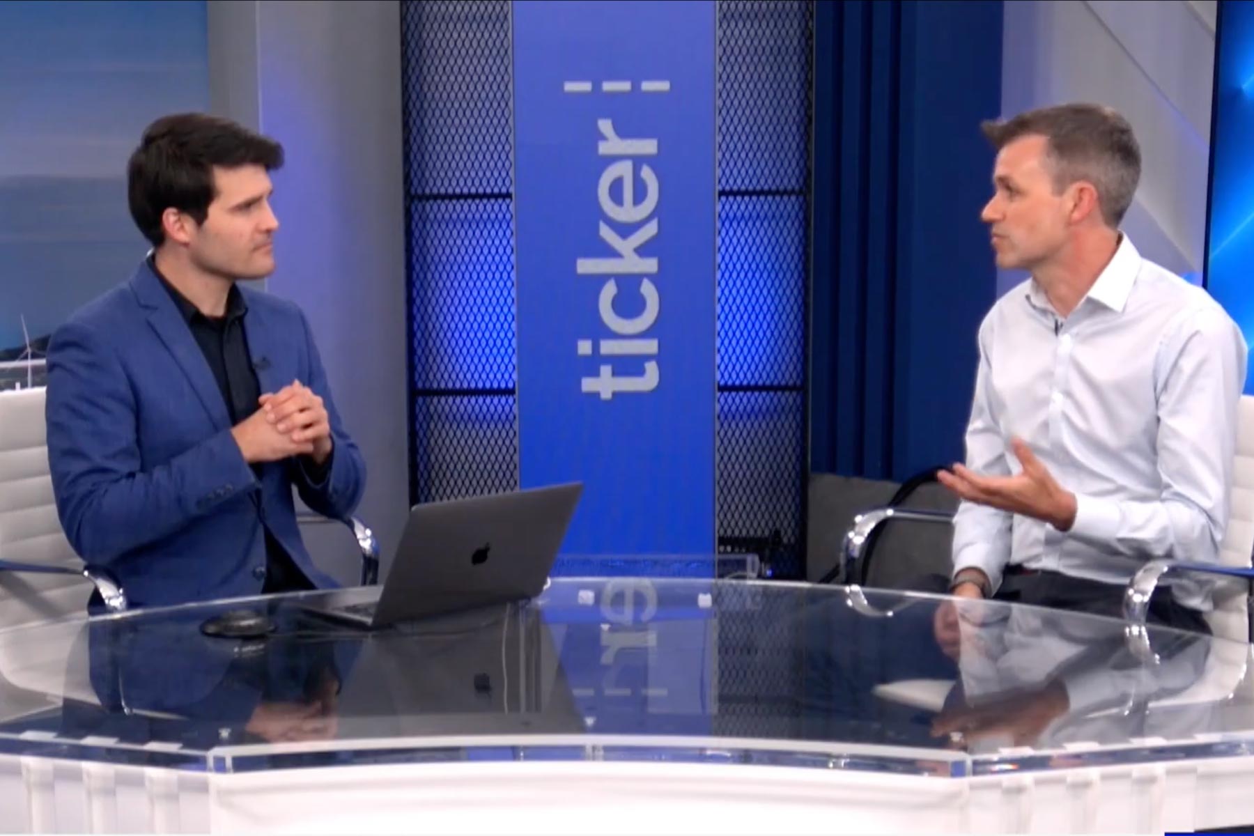 2 men in a news studio having a discussion