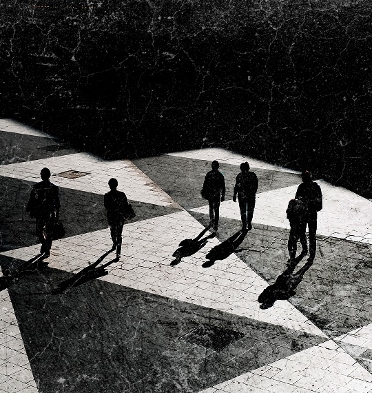 A group of people walking across a checkered floor.