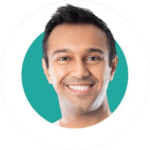 Smiling man with short dark hair against a teal circular background.