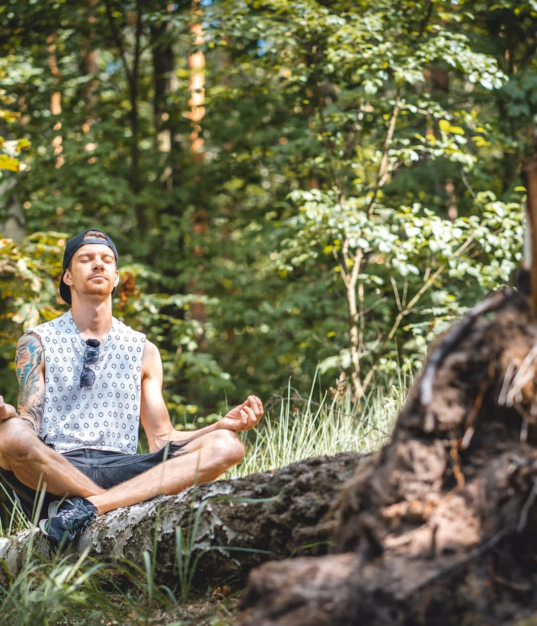 A person meditating in woods