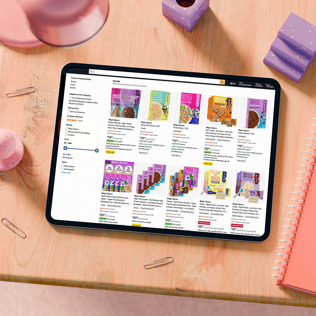 Tablet on wooden desk displaying an Amazon shopping page for cereal products.