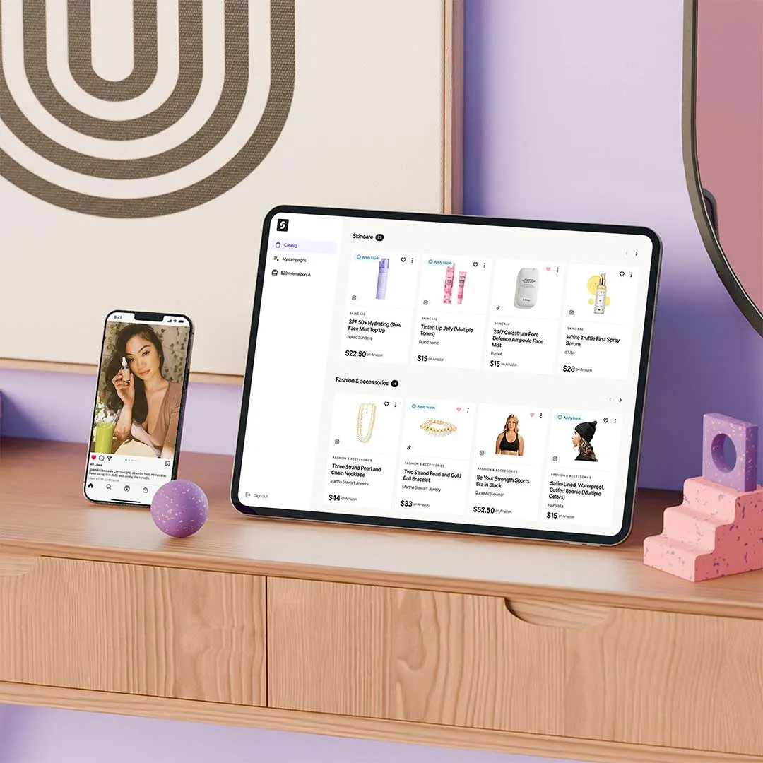 Wooden shelf with a smartphone showing a woman holding a dropper bottle and a tablet displaying an online shopping interface for skincare and fashion products.