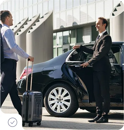 Professional driver providing airport taxi pickup service in Aspen Colorado for business traveler with luggage