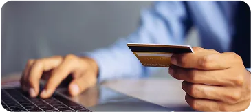 Customer entering credit card information online to reserve Colorado taxi service