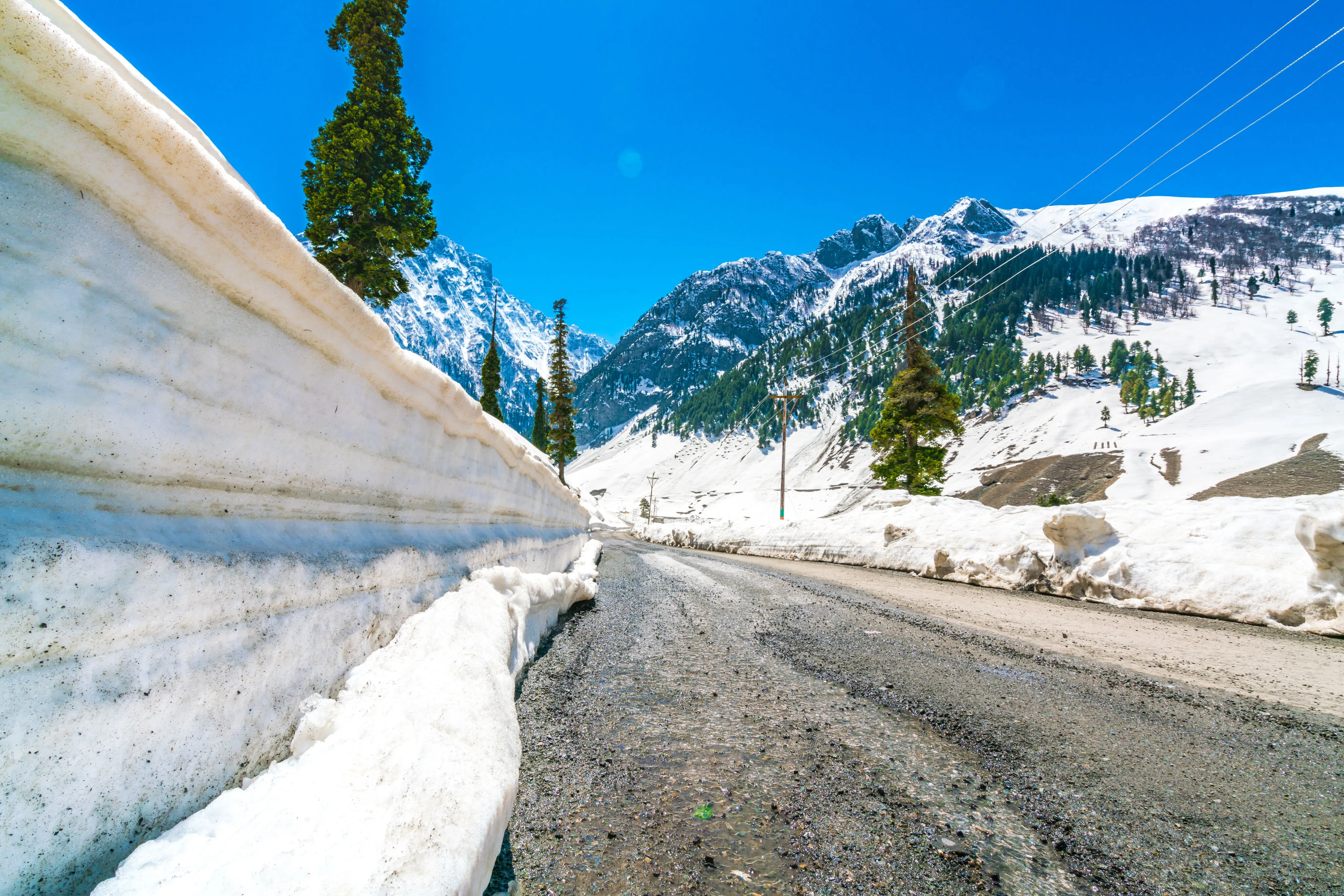 Snow-covered mountain road in Colorado during winter travel season