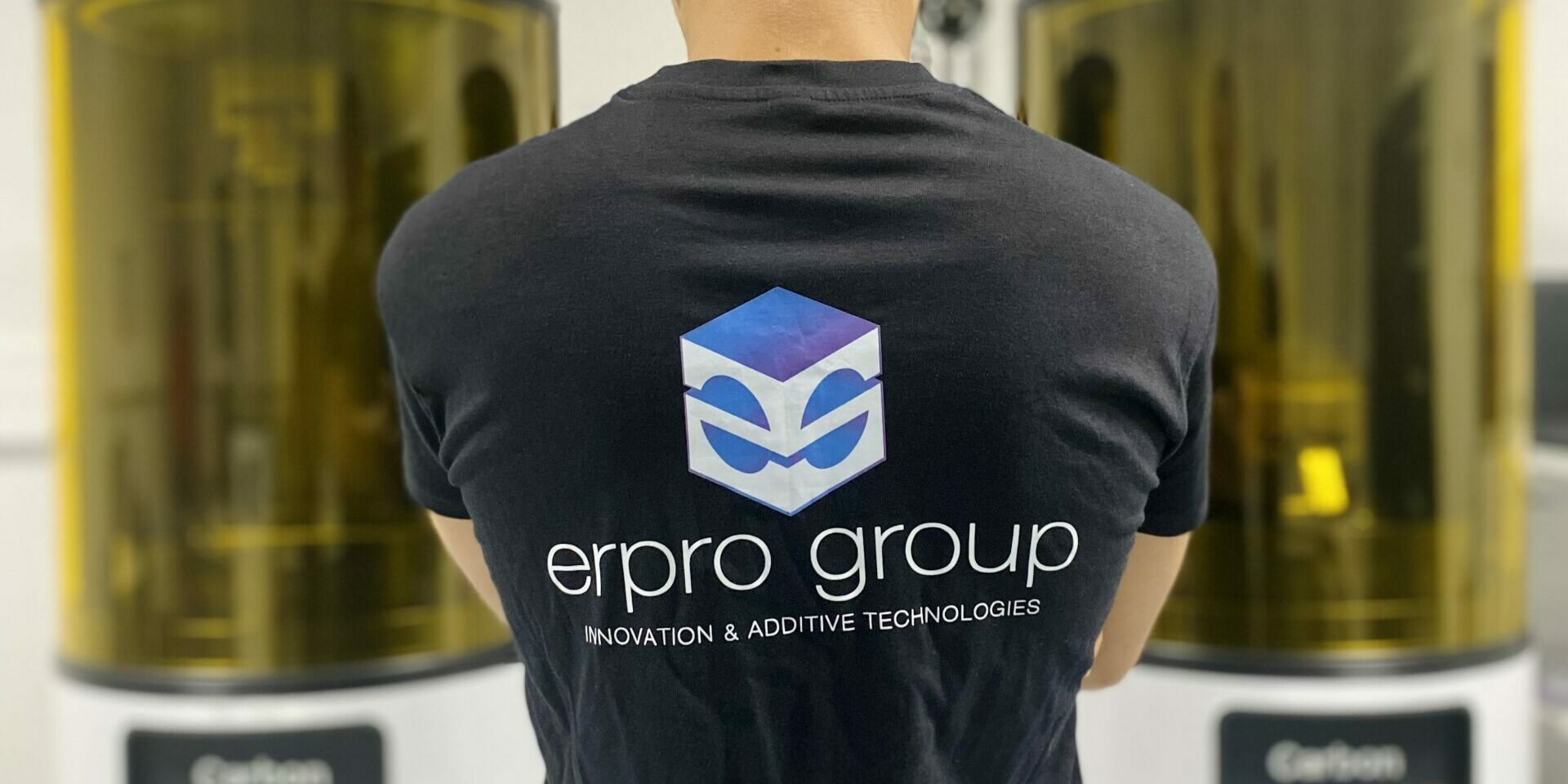 Erpro Group Employee Facing Two Printers