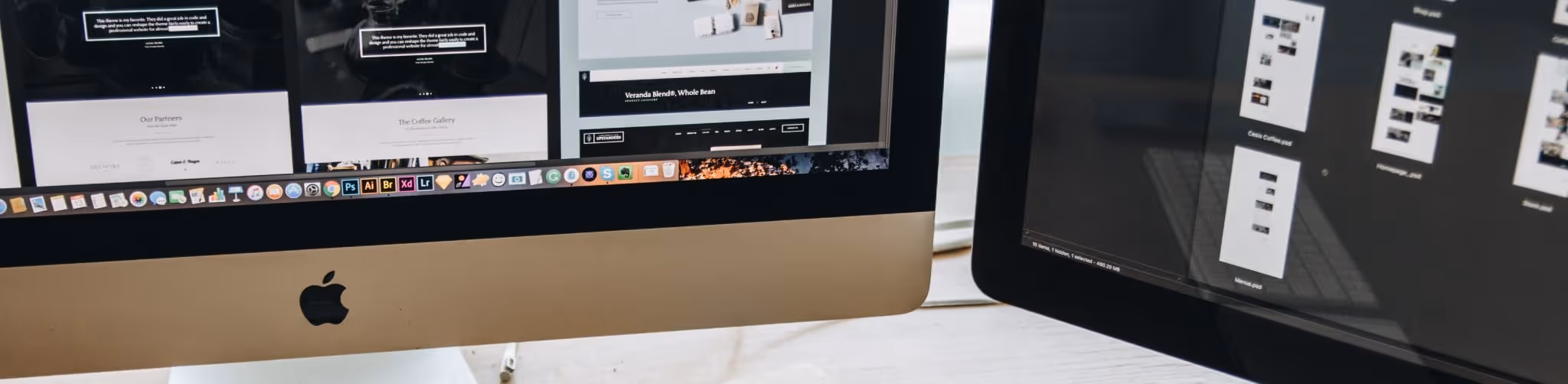 A young woman working in a machine shop. She is looking directly towards the camera, and is surrounded by men.